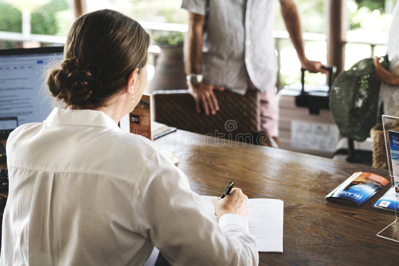Receptionist working at the front desk royalty free stock photos