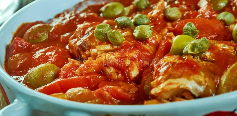 Recette de poisson cuit à la méditerranéenne. Recette de poissons cuits au four méditerranéen avec tomates et caps