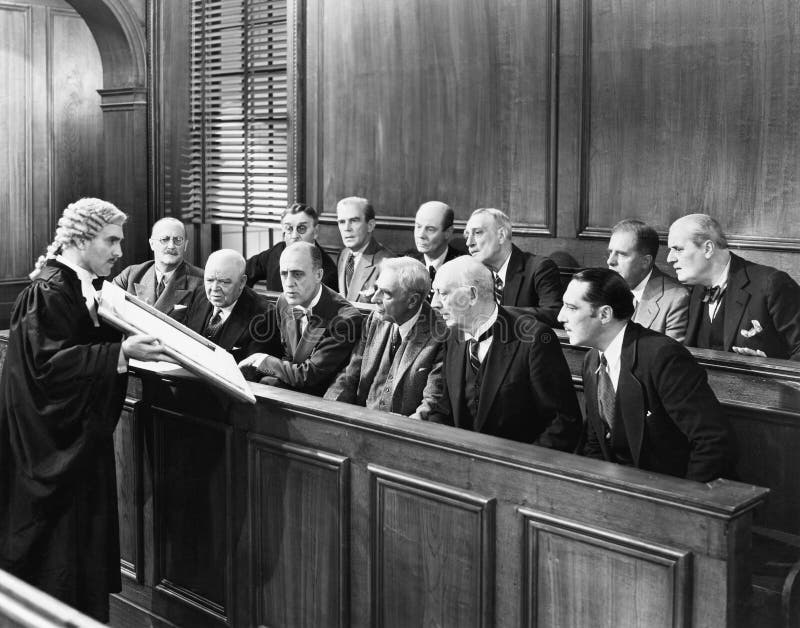 Lawyer showing evidence to the jury (All persons depicted are no longer living and no estate exists. Supplier grants that there will be no model release issues.). Lawyer showing evidence to the jury (All persons depicted are no longer living and no estate exists. Supplier grants that there will be no model release issues.)