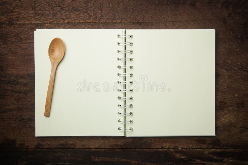 Recipe book and spoon on wooden table. Vintage rustic recipe book background stock images, royalty-free photos and pictures