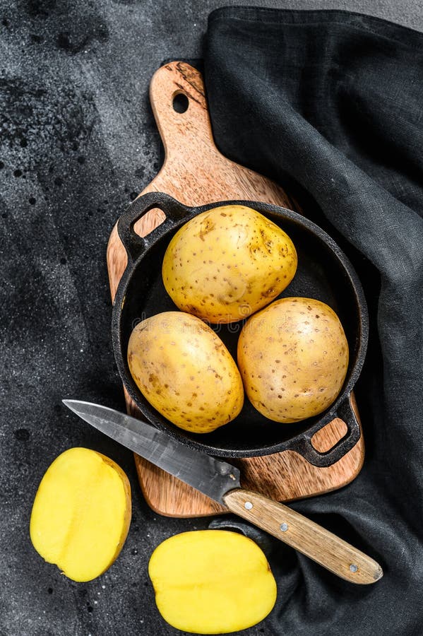 Recipe for Fried Potatoes, Organic Yellow Potatoes in a Pan. Black