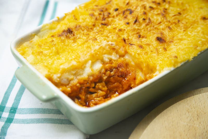 Minced Meat Pie with Tomato Covered with Mashed Potatoes and Gratin Cheese. Stock Photo Image