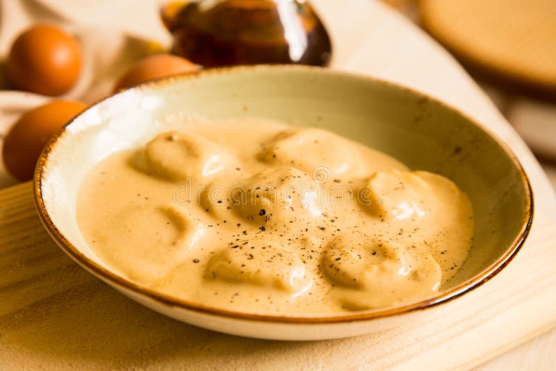 Panzerotti Pasta Stuffed with Pumpkin Cooked with Sauce. Traditional