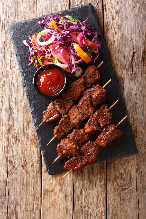 Recipe of a Spicy African Suya Kebab on Skewers with Fresh Vegetable ...