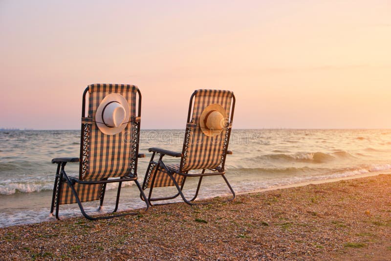 Recliner Beach Seatings while Sunset. Stock Image Image of coast