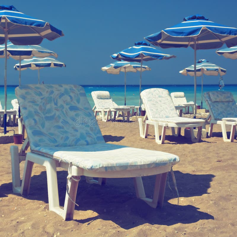 Recliners on beach stock photo. Image of outdoors, deck 74493632