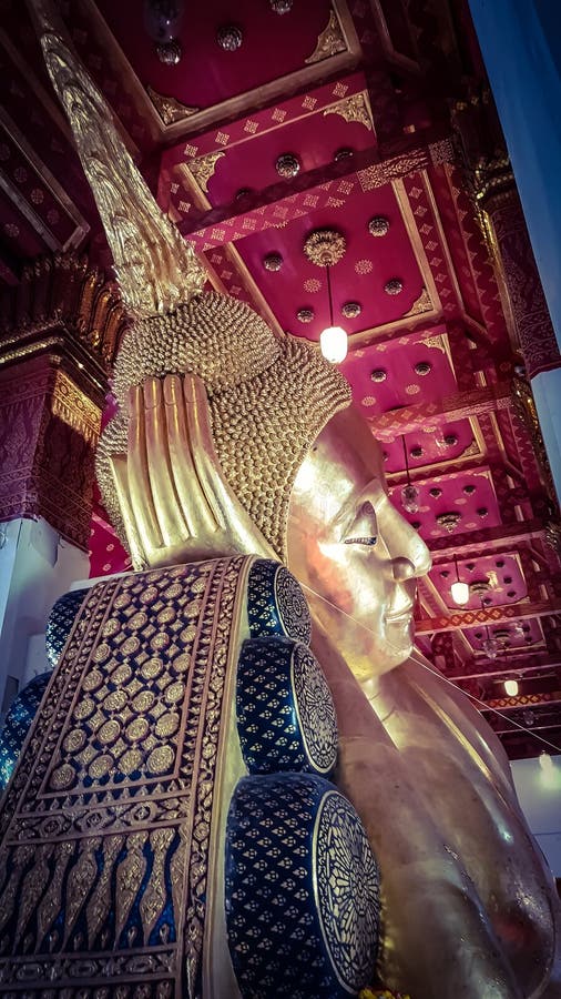 The reclining Buddha image Which is golden and beautiful at Wat Pa Mokkh stock images
