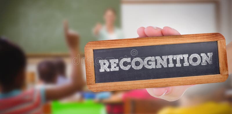 Recognition against pupils raising their hands during class stock photo