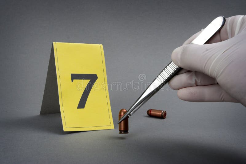 Collect evidence-an investigator collect fired cartridge. Collect evidence-an investigator collect fired cartridge