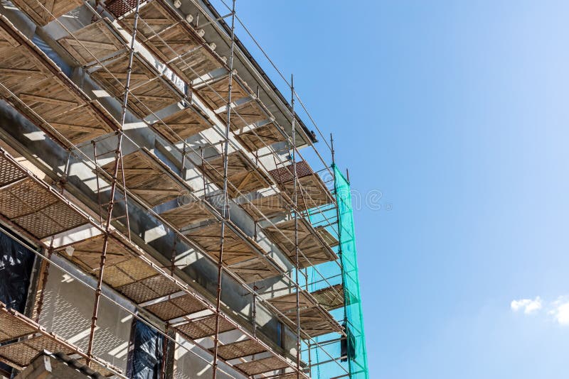 Reconstruction of old city building. scaffolding near building f