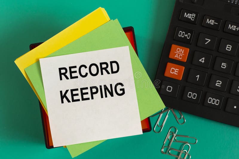 RECORD KEEPING Words on Note Paper Against the Background of a