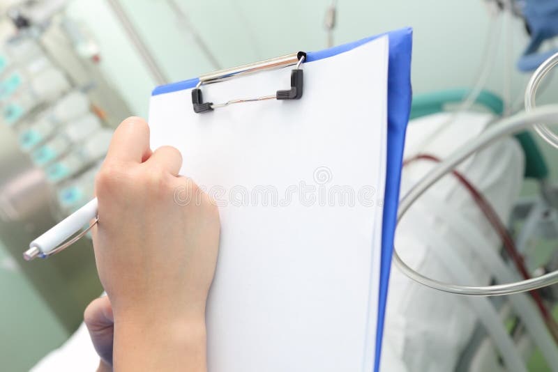 Recording the Status of the Patient in the Hospital Stock Photo Image