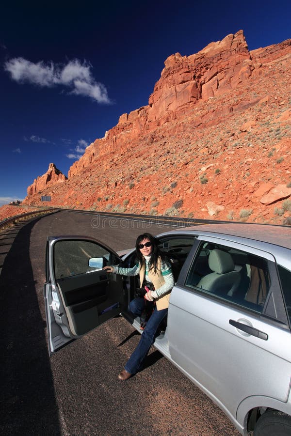 Girl driving car on the road through the bighorn canyon in wyoming. Girl driving car on the road through the bighorn canyon in wyoming.