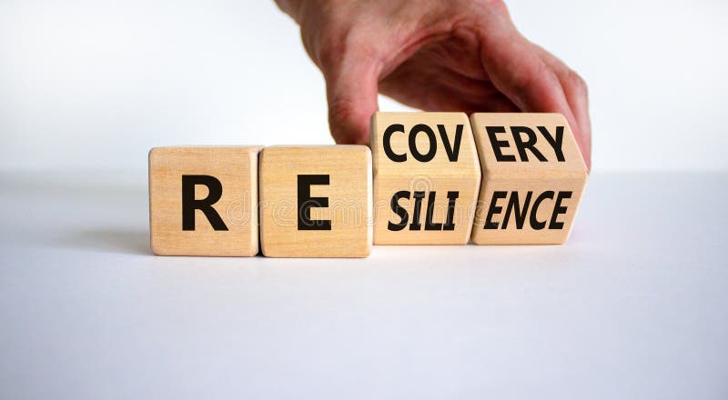 Recovery and resilience symbol. Businessman turns cubes and changes the word `recovery` to `resilience`. Beautiful white