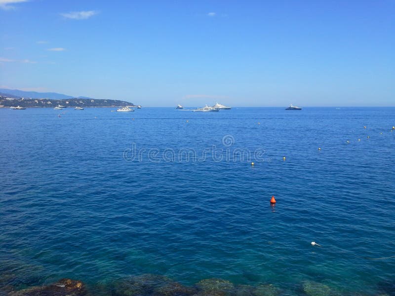 Recreational sailing boats backlit with cool blue tone, Monaco