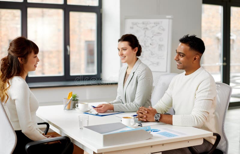 Recruiters having job interview with employee stock photo Recruiters having job interview with employee stock photo