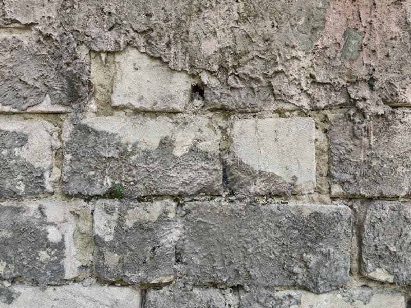 Rectangular Brick Wall. between the Stones Gray Cement Stock Image