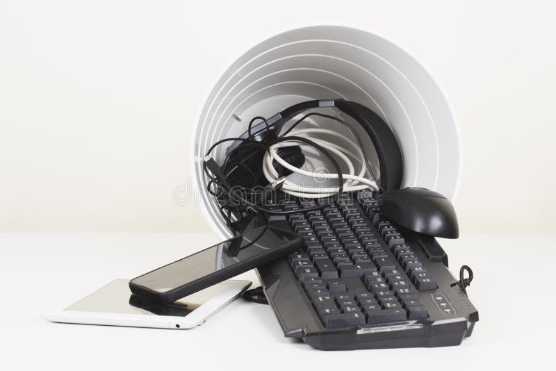 Recycling Bin and Old Digital Tablet, Cell Phone, Headphone, Cords and