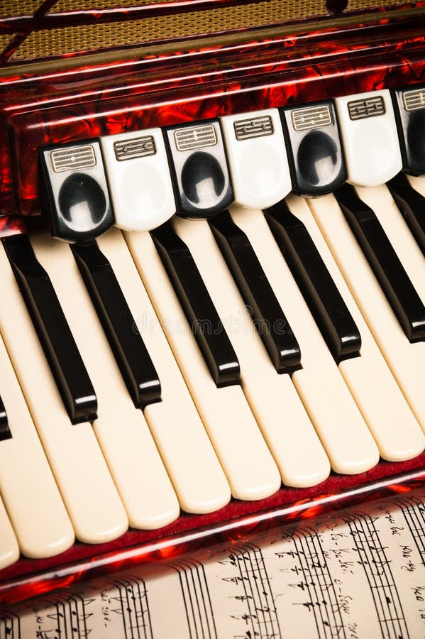 Red Accordion And Sheet Music Stock Photo - Image of close, object