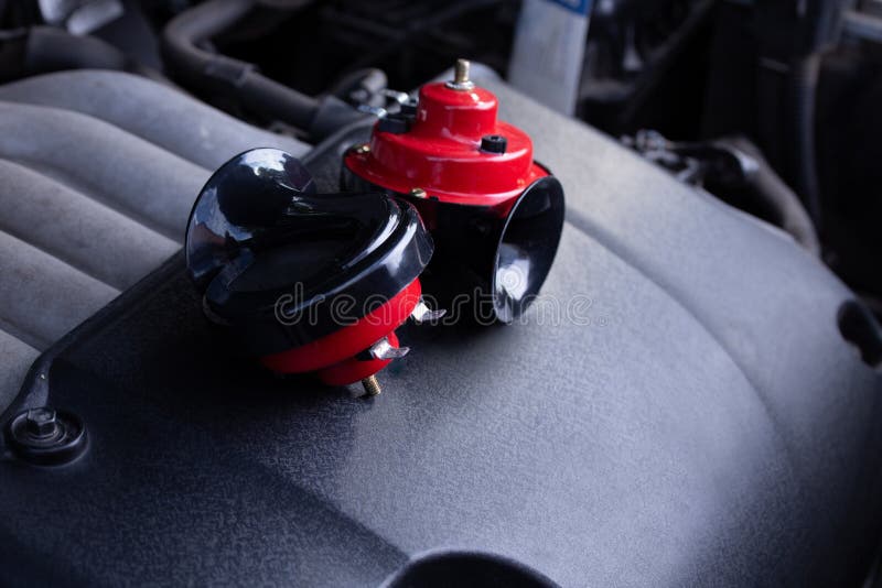 Red Air Horn for a Car on a Car Engine. Electric Car Air Horn Stock