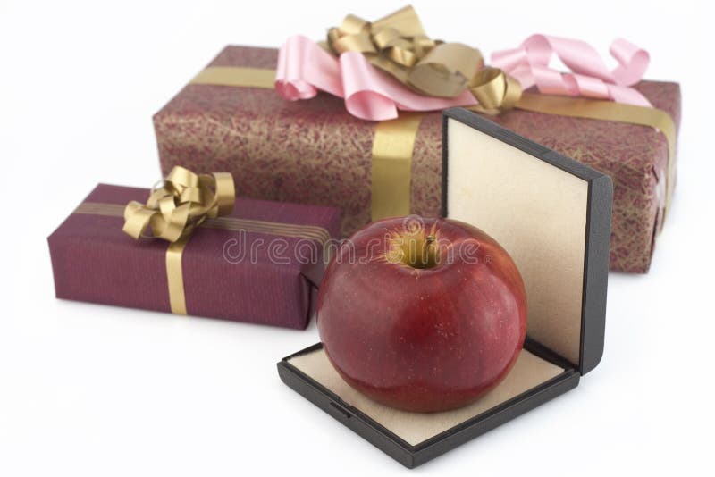 Red apple in box and two gifts boxes