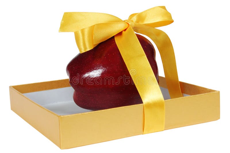 Red apple in box with yellow tape like gift