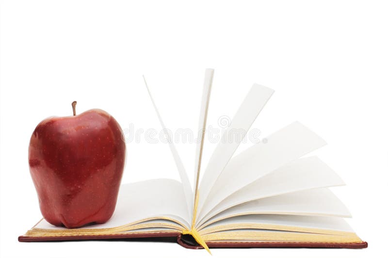 Red apple on the open book