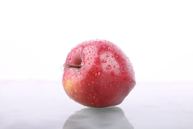 Red Apple on wet glass