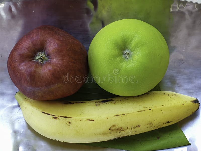 Red apples, green apples and bananas Placed royalty free stock photography