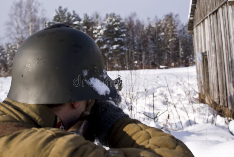 Red Army soldier aims from a rifle