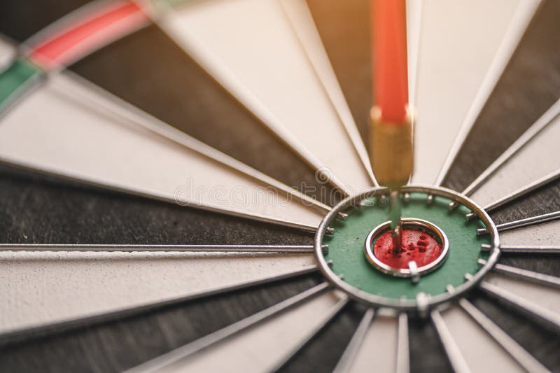 The red arrow in the middle of the dart board shown success. The concept of setting business goals Possible business planning stock image