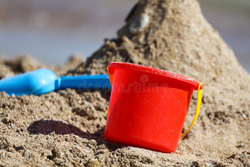 Red Baby Bucket in the Sand on the Beach Stock Image Image of object