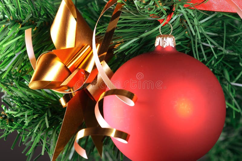 Red ball hanging from christmas tree