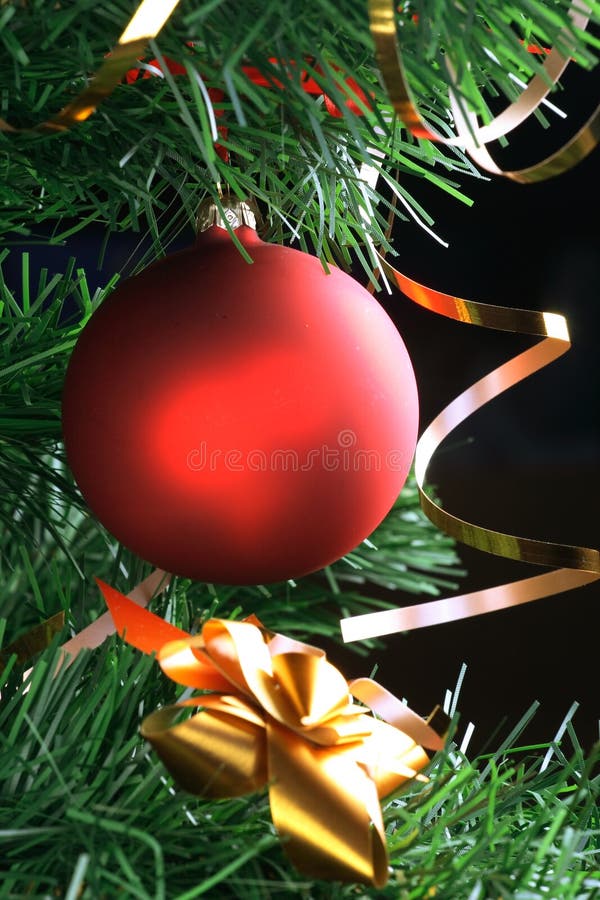 Red ball hanging from christmas tree