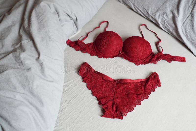Red Bar and Panty Lingerie Set on Bed Stock Photo - Image of