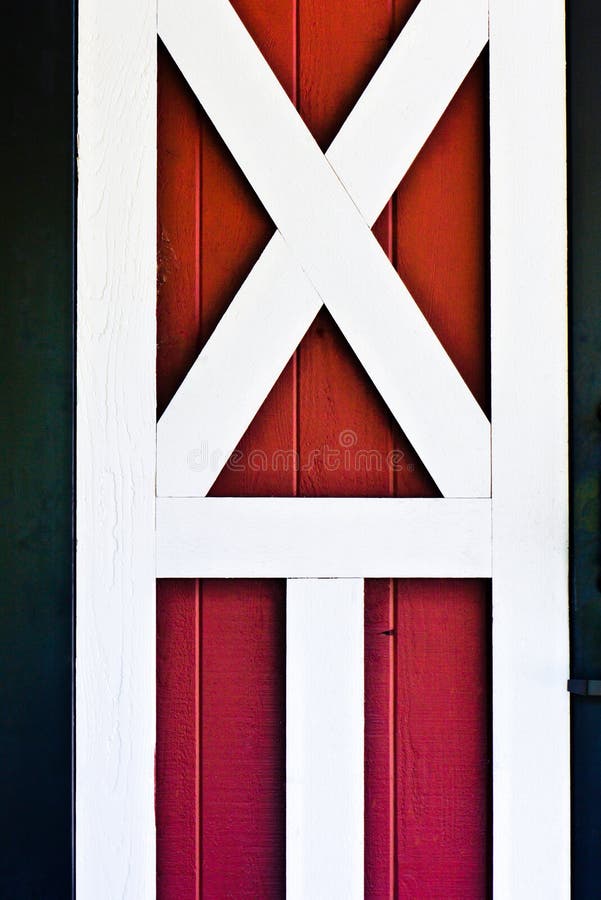 Red barn door with white trime