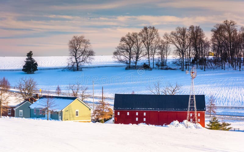 Red barn and snow-covered farm fields in rural York County, Penn stock images Red barn and snow-covered farm fields in rural York County, Penn stock images
