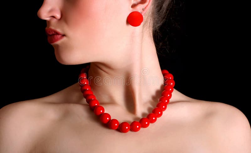 Red beads around neck of beautiful girl