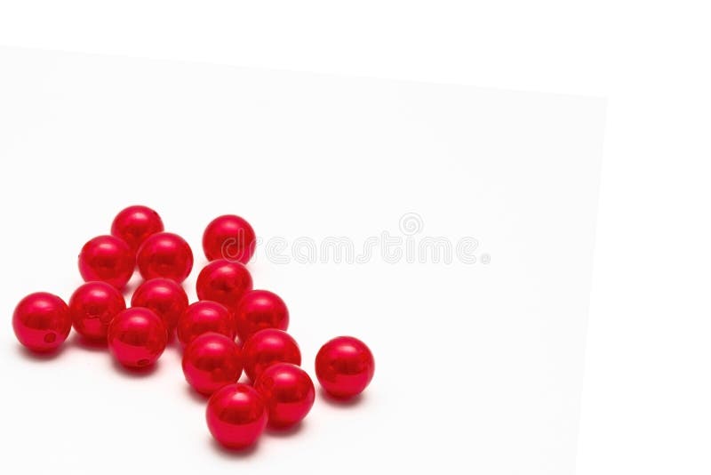 Red beads on white background. Copy space stock image Red beads on white background. Copy space stock image