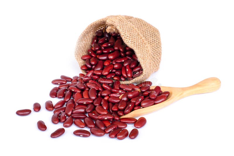 Closeup red kidney beans in wooden hemp sack bag and wooden scoop isolated on white background.