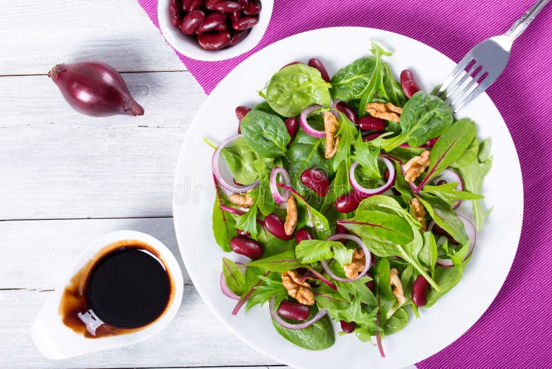 Red Beans Salad with Mix of Lettuce Leaves and Walnuts Stock Image
