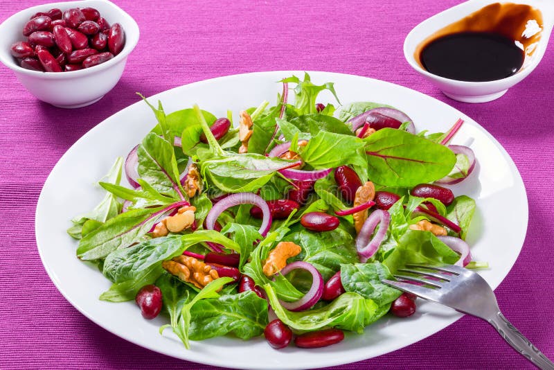 Red Beans Salad with Mix of Lettuce Leaves and Walnuts Stock Photo