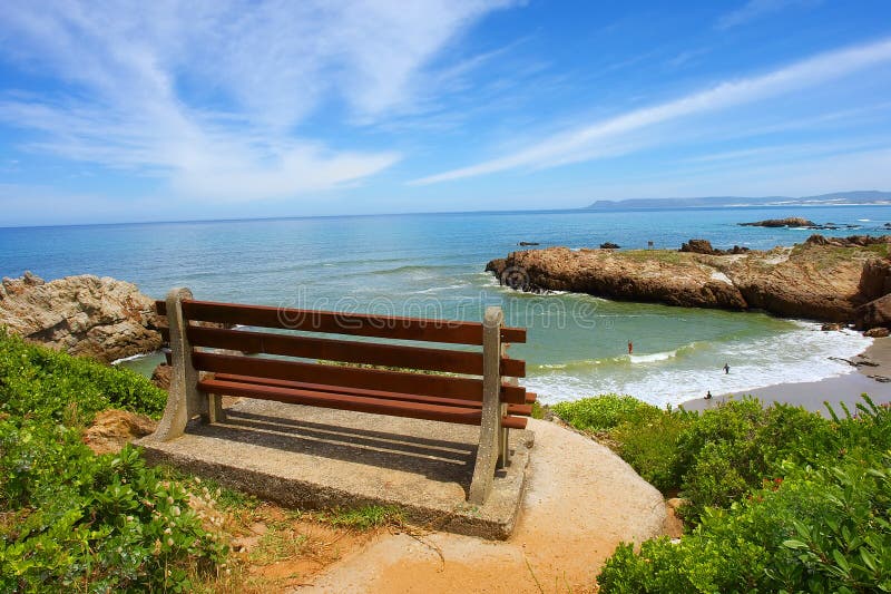 Red bench on cliff rocks royalty free stock images