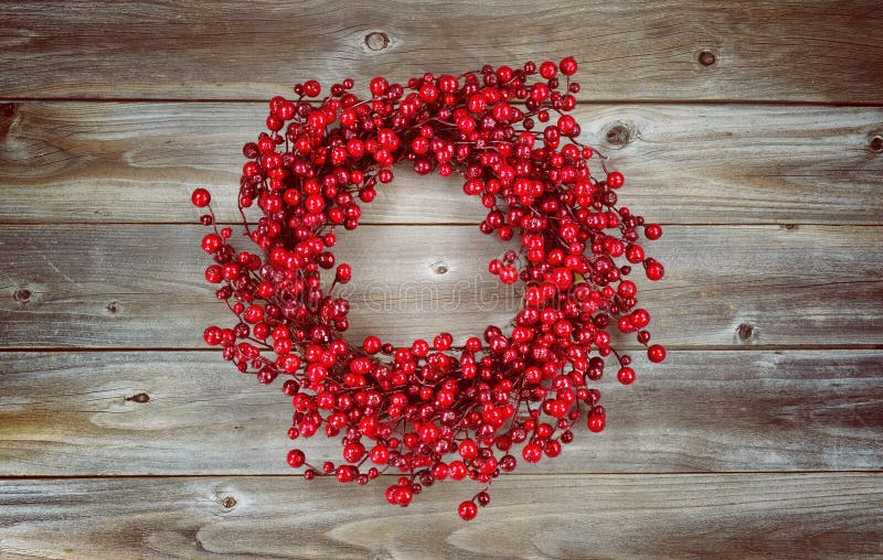 Red Berry Holiday Wreath on Aged Wood Stock Image - Image of rustic ...