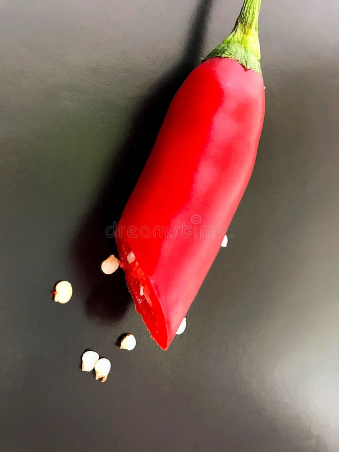 https://thumbs.dreamstime.com/b/red-bitter-hot-chili-pepper-cut-half-isolated-object-red-bitter-hot-chili-pepper-cut-half-124191706.jpg