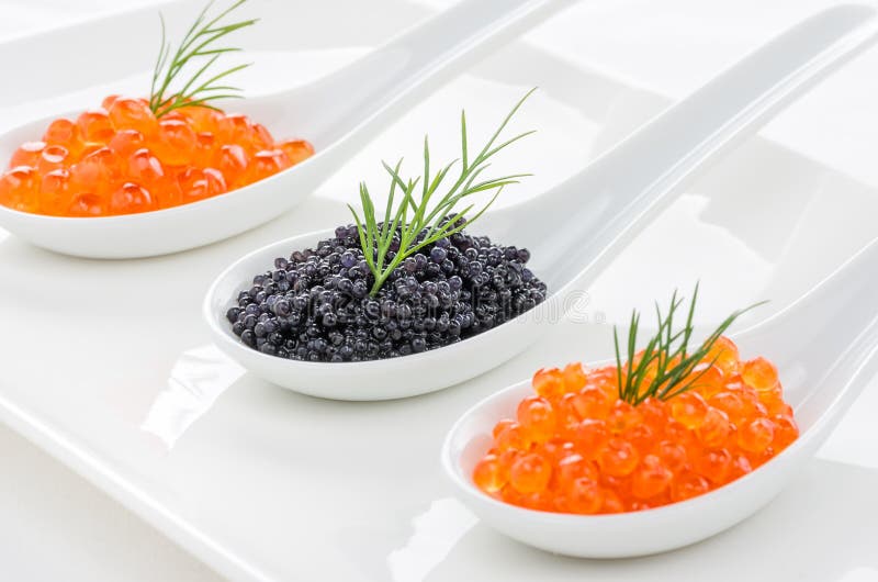 Red and black caviar on spoons