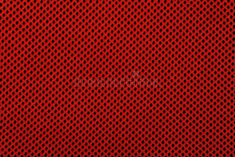 Red and black textile background with diamond pattern, background texture closeup