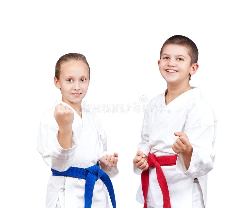 With red and blue belt the children stand in rack of karate royalty free stock photos With red and blue belt the children stand in rack of karate royalty free stock photos