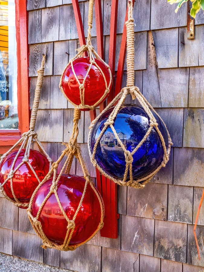 https://thumbs.dreamstime.com/b/red-blue-glass-fishing-floats-hanging-nets-wooden-wall-glass-fishing-floats-hanging-wall-174563266.jpg