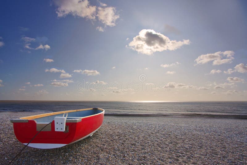 Red boat on beach